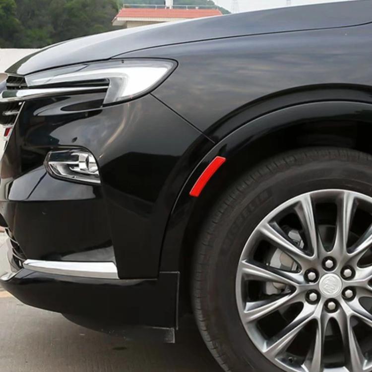 Red reflective fender warning decal strip on a car front wheel arch