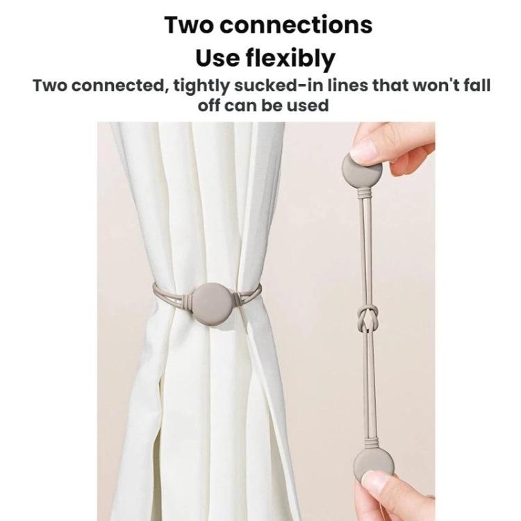 Two connected silicone cable organizer ties with round bases for cord bundling