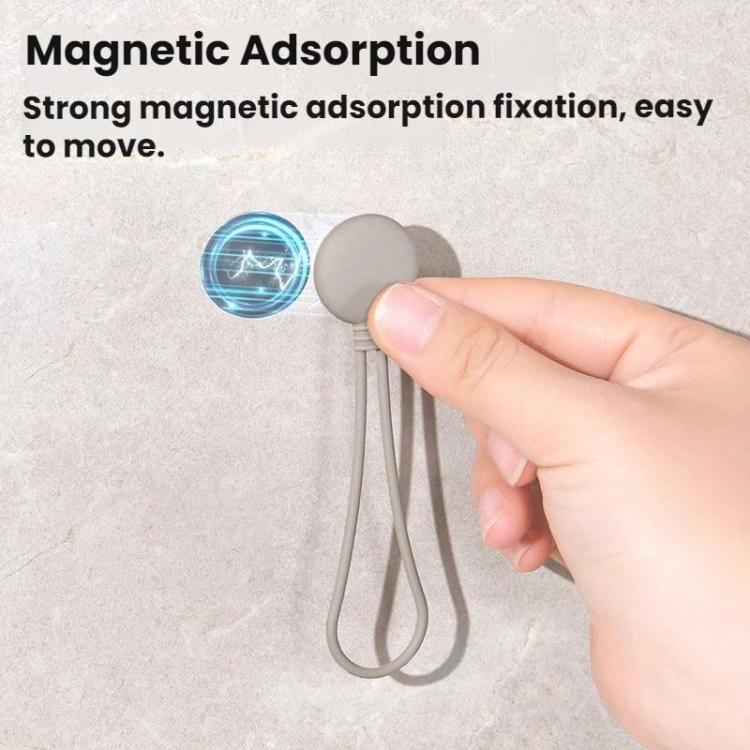 Magnetic suction cable organizer with round silicone base holding two cords