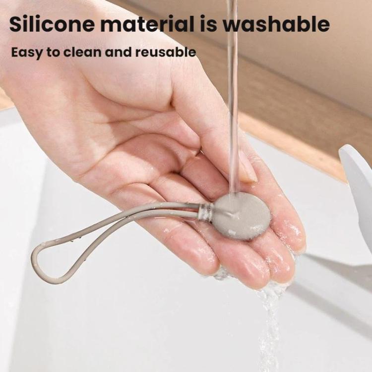 Washable silicone cable organizer tie held under running water