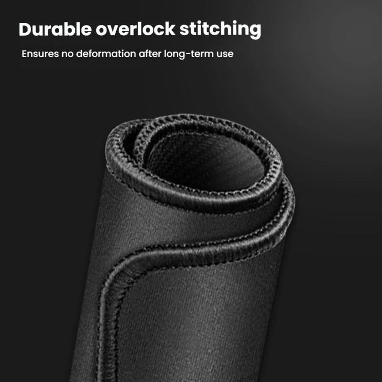 Coffee machine pad close-up of durable stitched edge on dark fabric with rubber backing