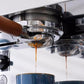 Stainless steel portafilter basket with fine mesh perforations under the spout