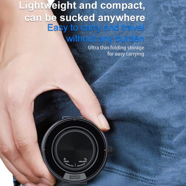 Black foldable magnetic car phone holder compact for travel with hand holding it