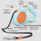 Light blue retractable dog leash with orange button and black webbing, chrome hook