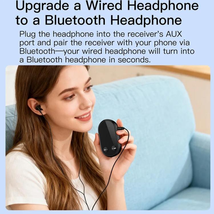 Black Bluetooth receiver upgrading a wired headphone via 3.5mm AUX plug