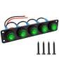 Black LED marine panel switch with four green round buttons and blue terminal covers