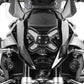 Clear headlight protector covering twin headlight lenses on motorcycle
