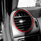 Red-bordered circular vent trim sticker on dashboard air vent opening