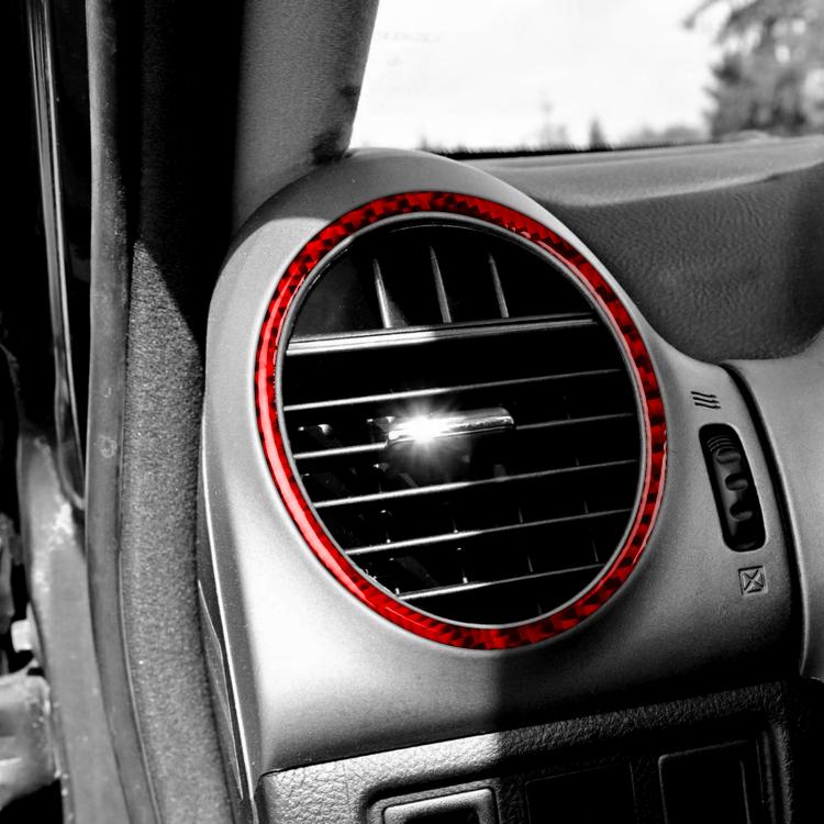 Red-bordered circular vent trim sticker on dashboard air vent opening