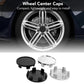 Car wheel with installed wheel hub center caps; black and silver set shown.