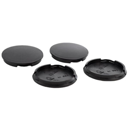 Set of 4 black wheel hub center caps with snap tabs, blank 55mm outer diameter