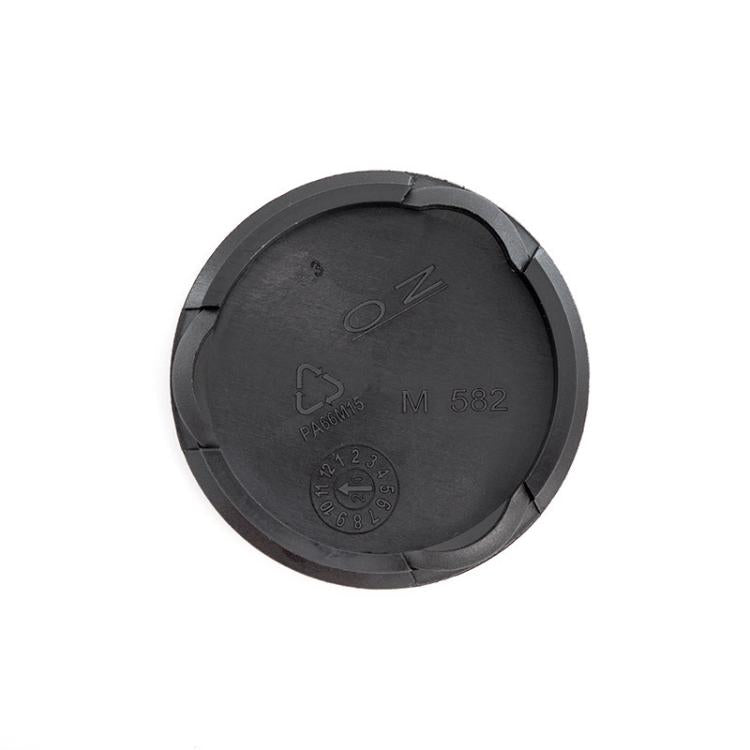 Black wheel center cap underside with raised markings and locking tabs, 55mm