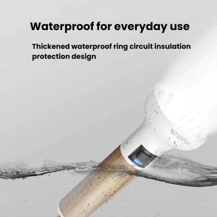 Wood-handled LED flashlight with water droplets and illuminated switch indicator
