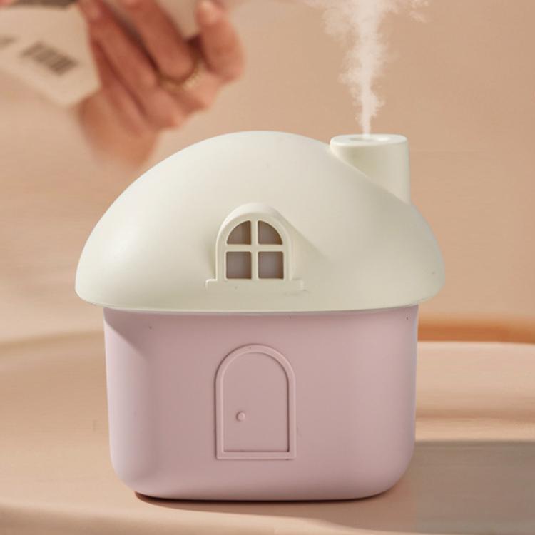 Pink mini house desktop humidifier with white roof and front door panel, no visible light