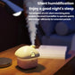 Mini house desktop humidifier with warm-lit window, steam mist on desk