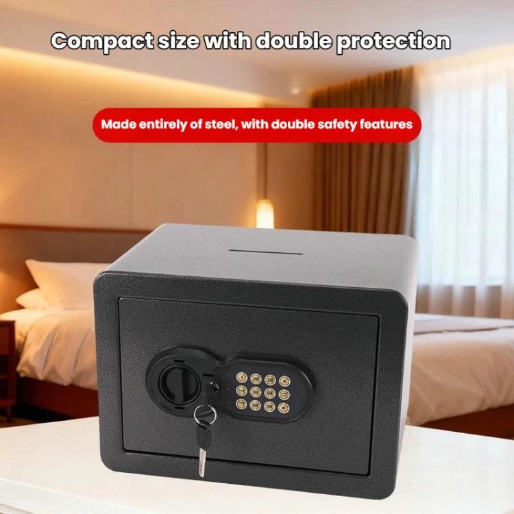 Black concealed wall safe with key and numeric keypad on the front access panel.