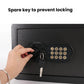 Black concealed wall safe front panel with key inserted into the key lock.