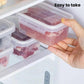 Clear airtight food storage container with single-lock lid, hand lifting the cover