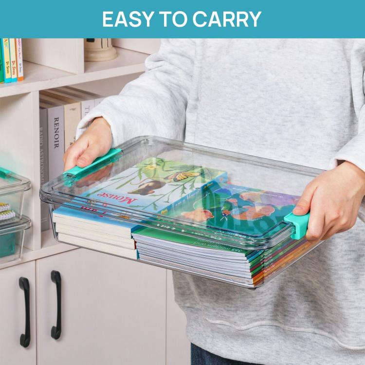 Stackable clear storage boxes with teal latch lids being carried