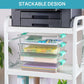 Clear stackable storage boxes with teal latch lids on a white shelf