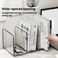 Acrylic desktop book organizer with wide opening and black ribbed panels, hand pulling books.