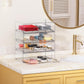Clear drawer-style storage rack holding office items inside transparent bins