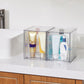 Clear two-section perfume organizer with front dust shields for bottles and tubes
