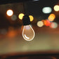 Glowing car LED pendant light bulb with black cap and teardrop glass