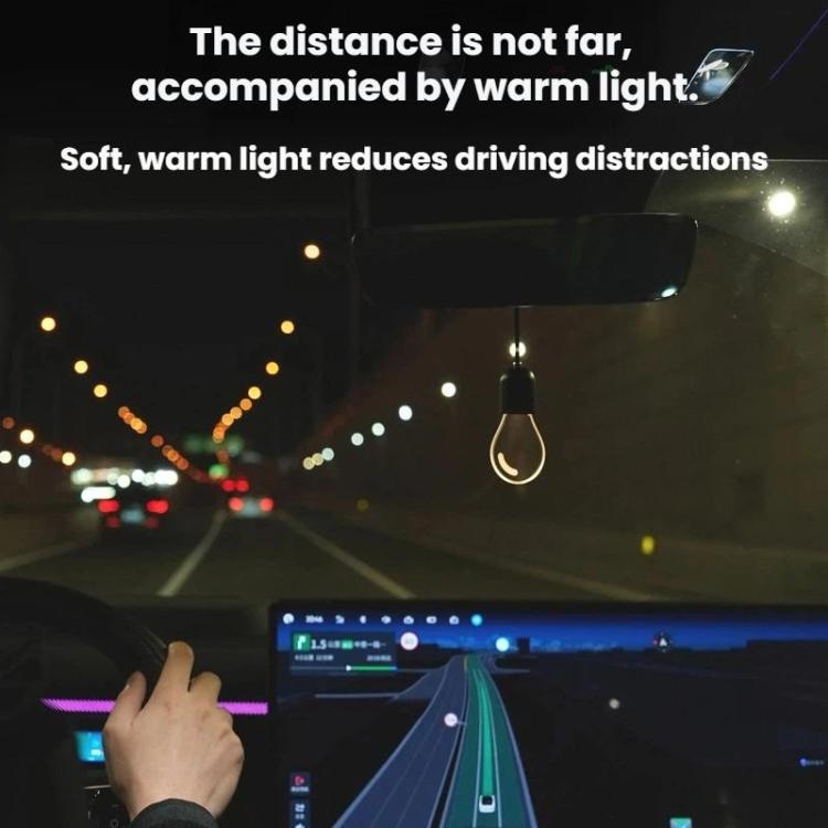 Warm-glowing car LED pendant light bulb hanging from the ceiling