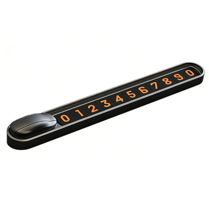 Temporary parking number plate with orange digits on a black sliding housing