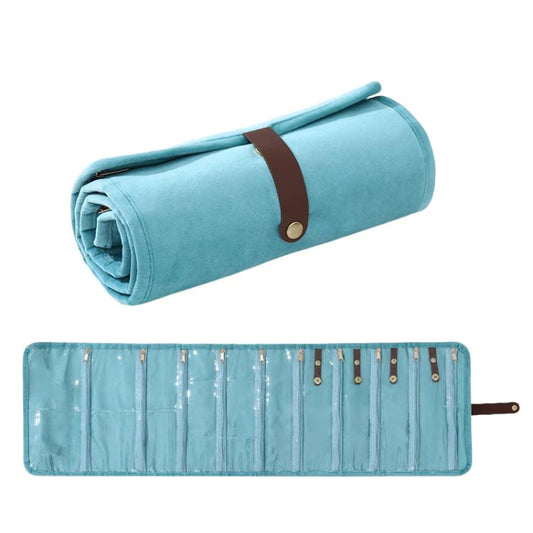 Light blue roll-up velvet jewelry organizer bag with brown strap and rows of pockets