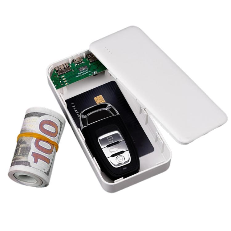 White power bank-shaped hidden storage box, lid open showing key fob and cash rolls