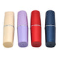 Lipstick-shaped pillbox set in beige, purple, red, and navy with caps on.
