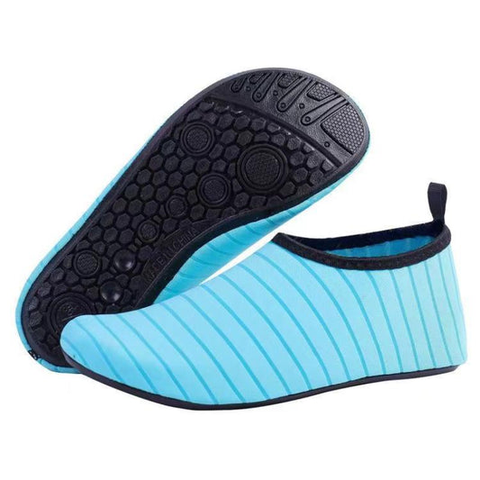 Blue striped slip-on indoor shoe with black textured outsole underside