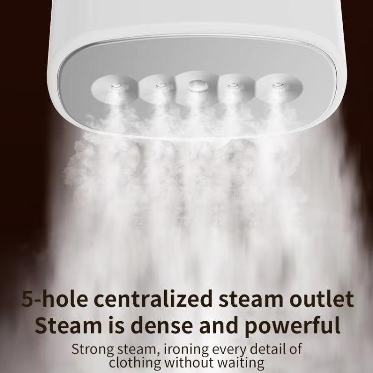 Close-up of white steamer head with multi-hole steam outlet releasing steam