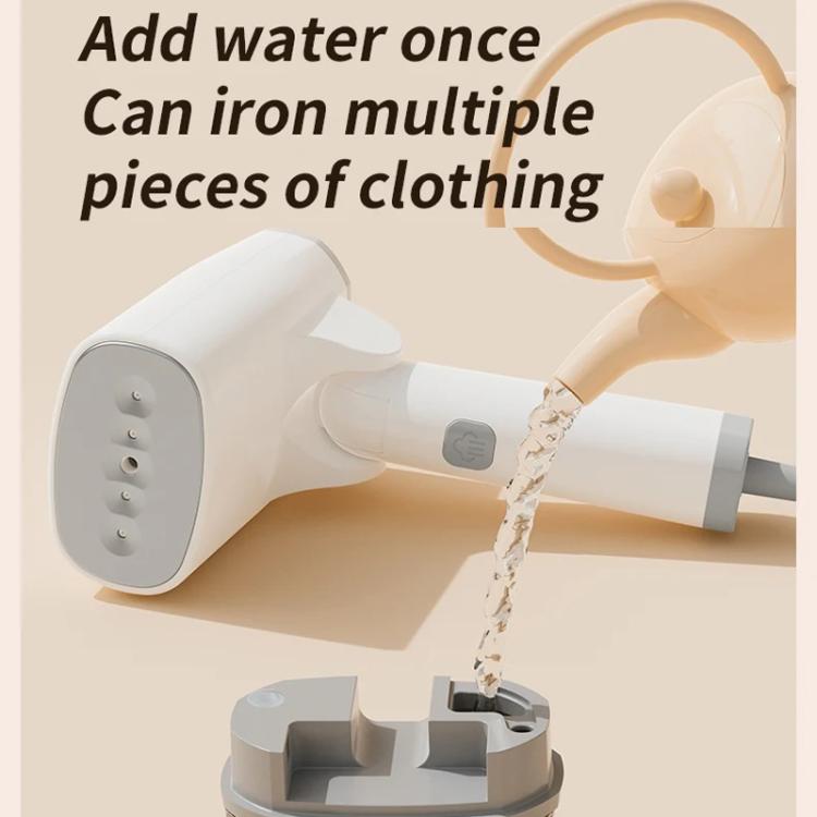 White garment steamer with water added, pouring steam while ironing multiple clothes
