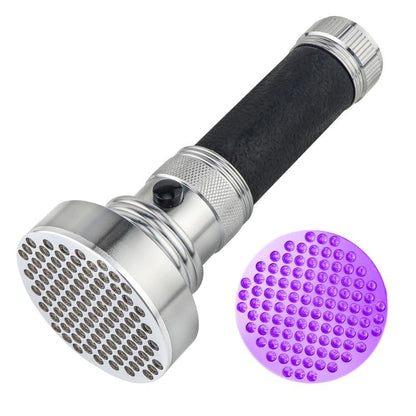 Black and silver UV flashlight with wide metal head and glowing purple LED light