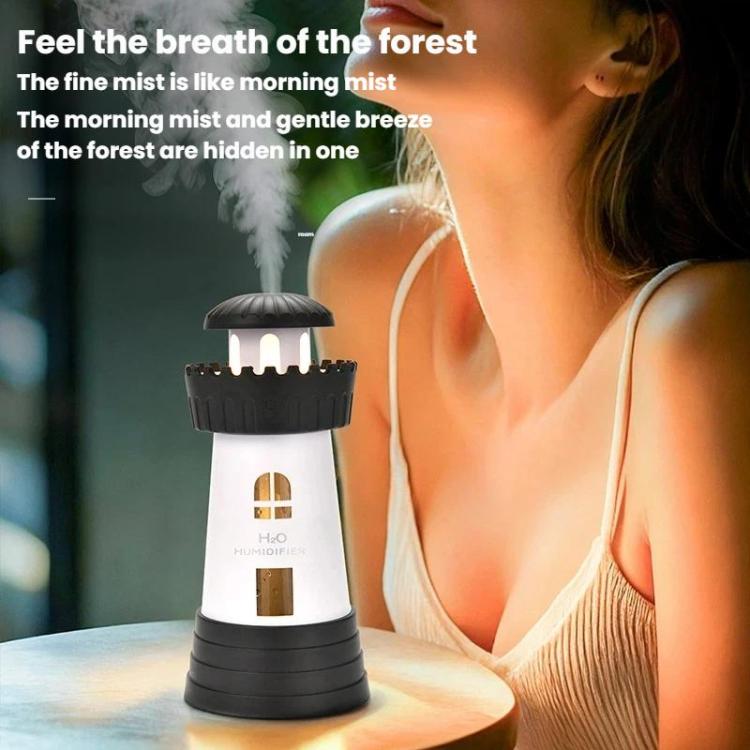 Dark gray lighthouse-shaped humidifier with illuminated windows and ribbed base