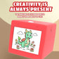 Red mini wireless thermal printer with screen showing a green dragon line drawing