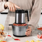 Stainless steel electric meat grinder being held on a kitchen counter