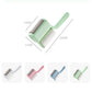 Household lint roller brush with mint green handle and gray bristles roller