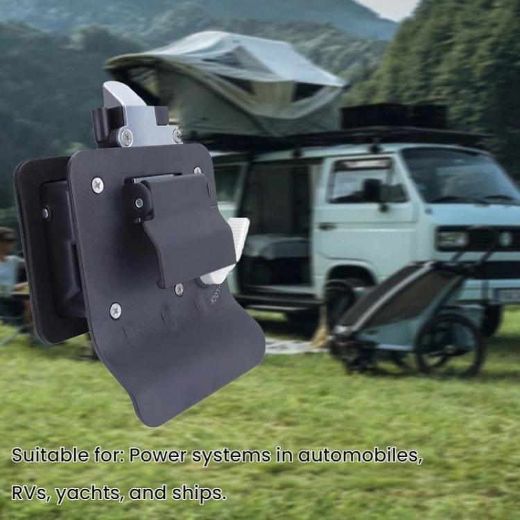 Black RV door lock mounted on exterior door panel with key cylinder