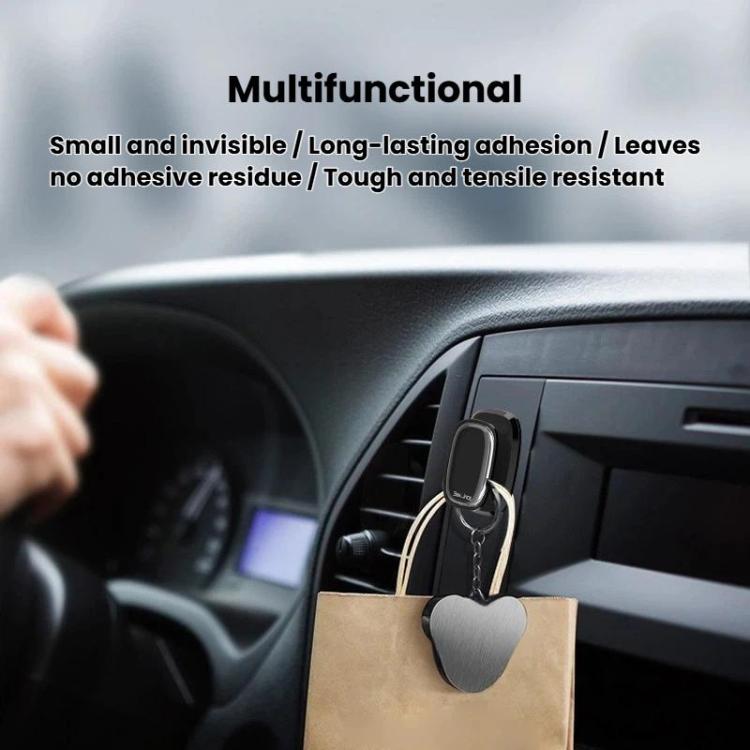 Mini self-adhesive car hook on dashboard holding a shopping bag handle