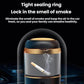 Black portable car ashtray vacuum cleaner with sealed lid and smoke-residue visible