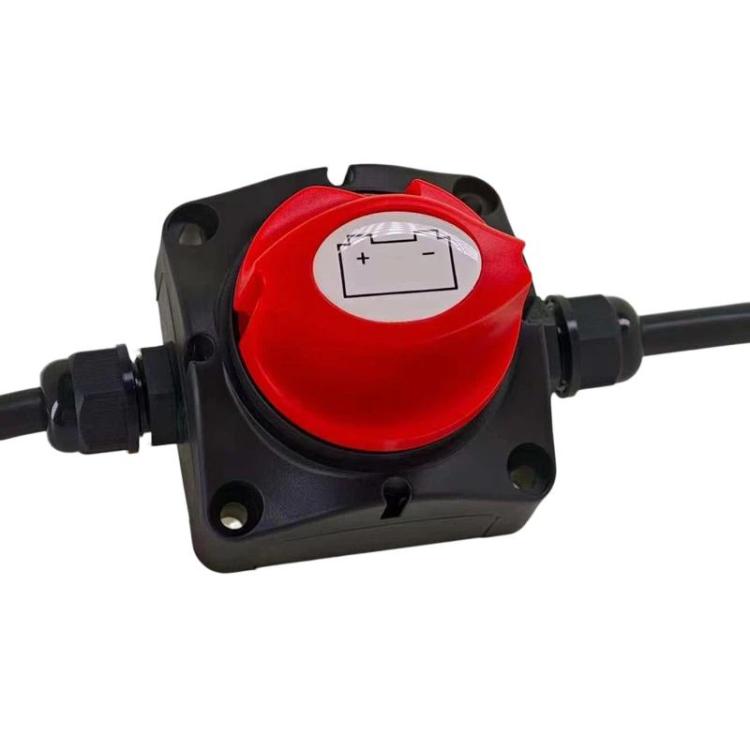 Car battery cut-off switch top with red knob and black square base housing