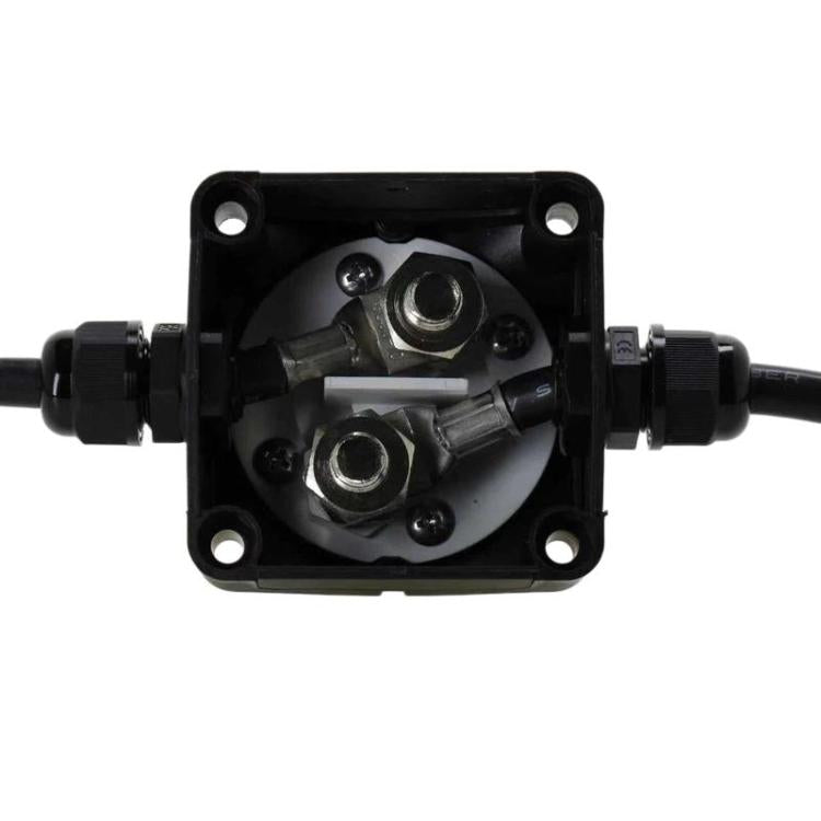 Car battery cut-off switch base with exposed metal terminals inside black housing