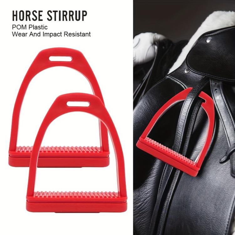Red plastic horse stirrups with ribbed footplate, shown on a leather saddle
