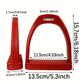 Red plastic horse stirrup with ribbed footplate, shown with size reference