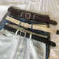 Woven canvas belt with square buckle, shown with denim waistbands in multiple colors