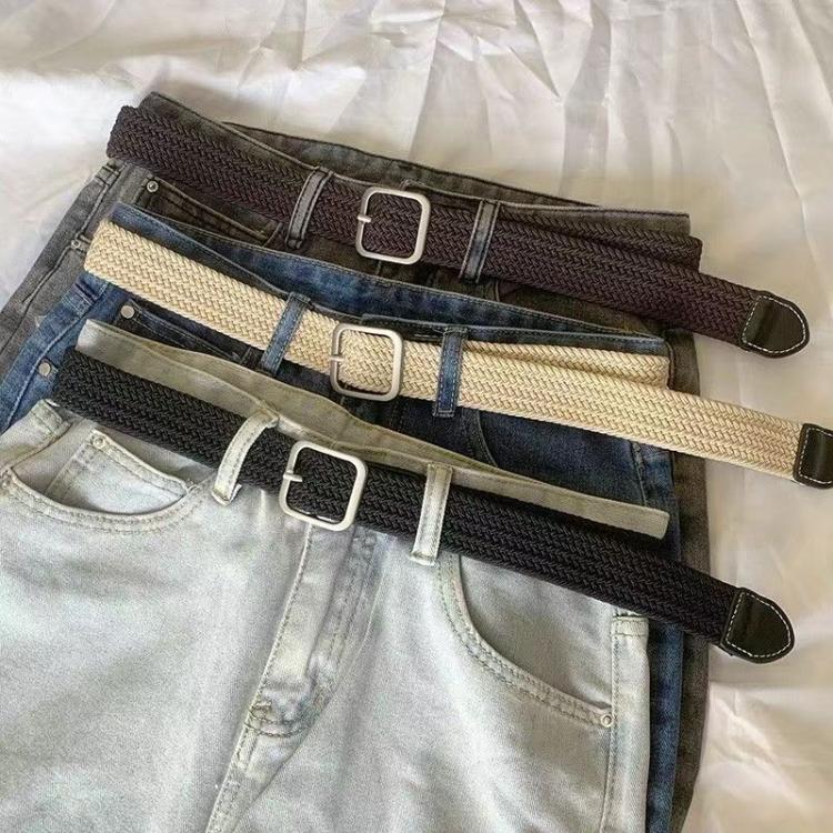 Woven canvas belt with square buckle, shown with denim waistbands in multiple colors